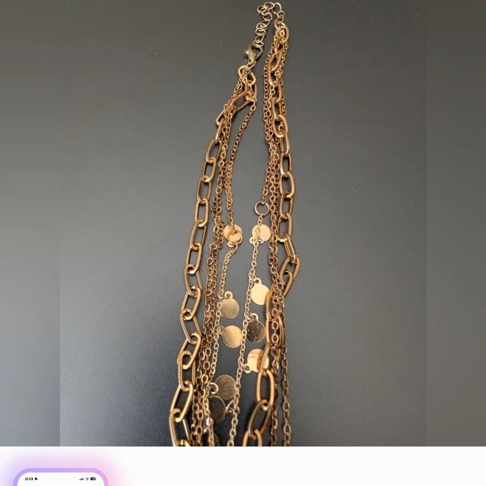Elegant Triple-Strand Necklace in Coppery Metal with Crystal Teardrops